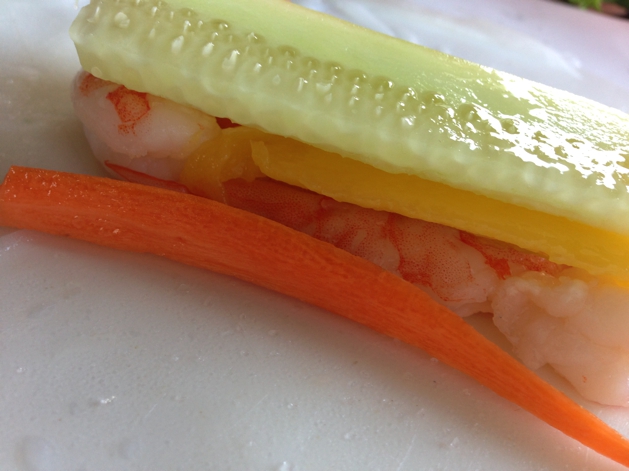 Begin to layer mango and all other vegetables on top of shrimp.