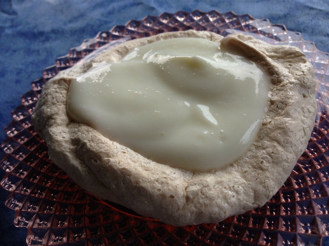 Honey-sweetened Greek yogurt on top of pavlova.