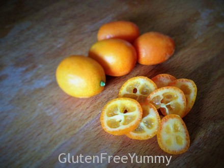 Colorful sliced kumquats are tart on the inside and sweet on the outside.