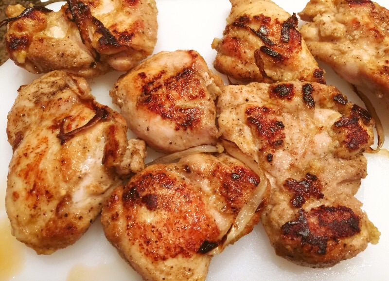 Freshly grilled organic chicken thighs.